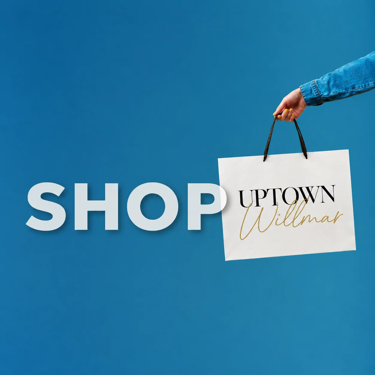 Shop Uptown Willmar: a hand holding an Uptown Willmar shopping bag